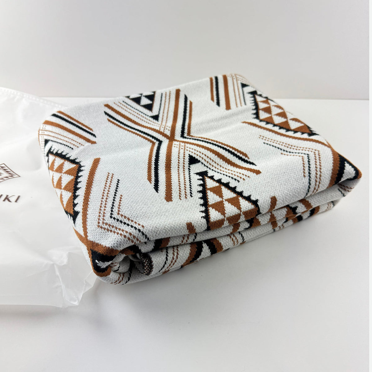 Cosy and Soft Māori Blanket in White Brown and Black Niho Pattern - ShopNZ