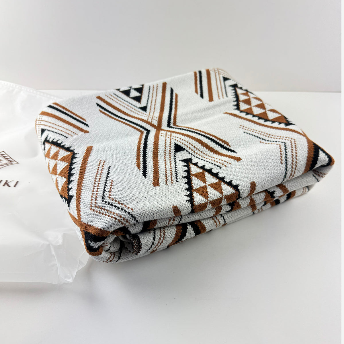 Cosy and Soft Māori Blanket in White Brown and Black Niho Pattern