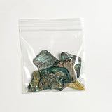 Bag of 10 Polished Paua Pieces with Hole for Cord or Wire - ShopNZ