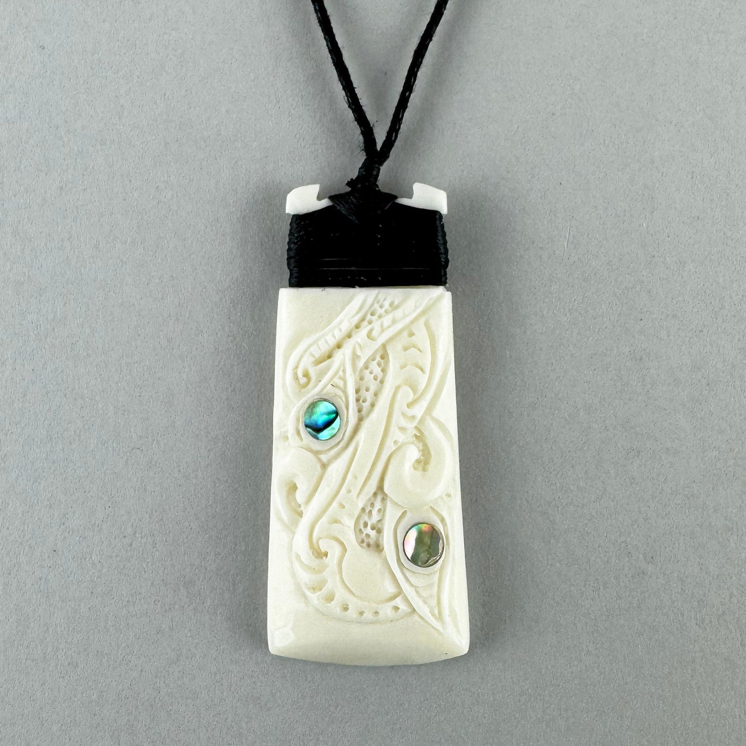 Finely Carved Maori Toki Manaia Necklace - ShopNZ