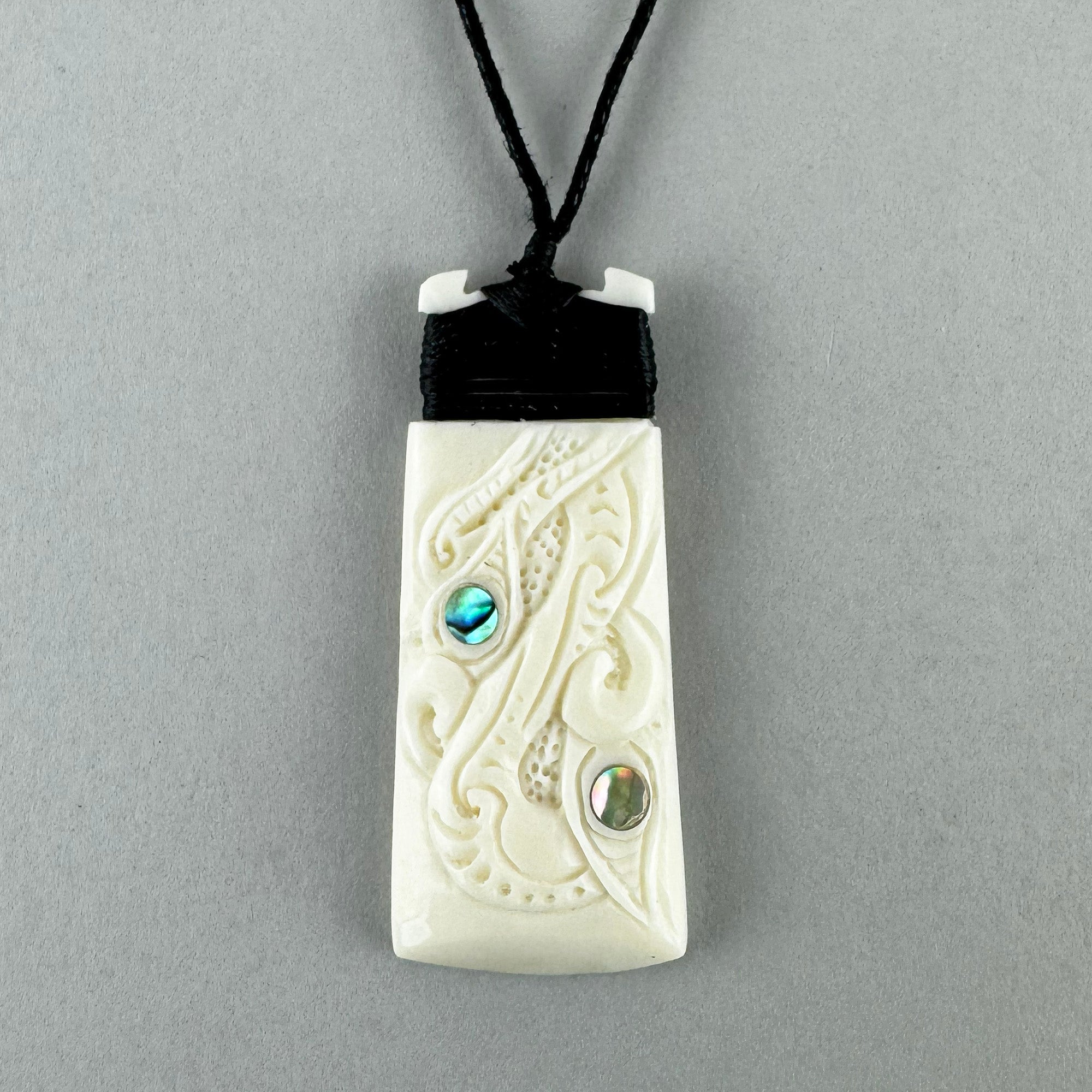 Finely Carved Maori Toki Manaia Necklace - ShopNZ