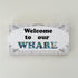 Paua Welcome to our Whare Canvas Sign - ShopNZ