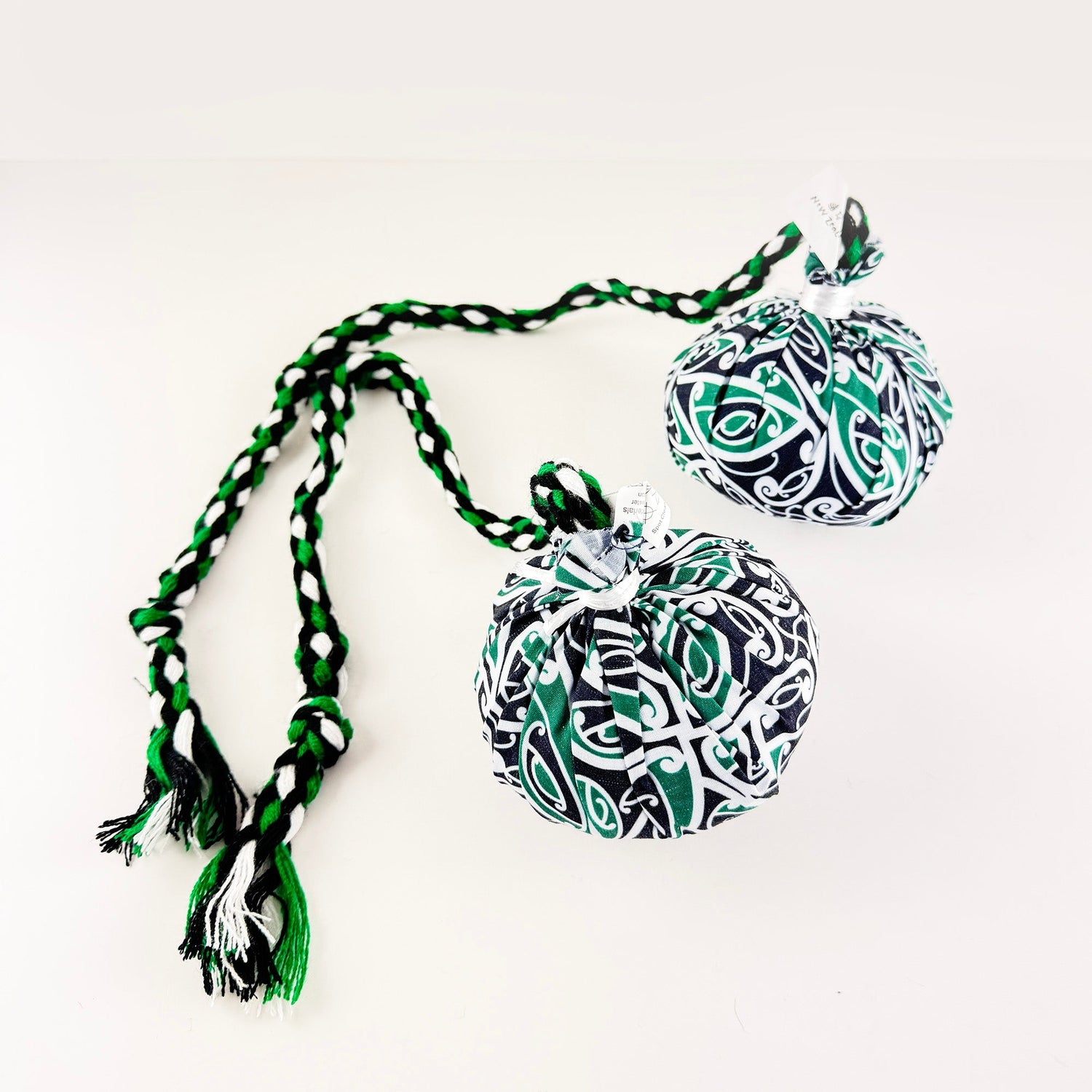 Set of Māori Poi with Green White and Black Patterned Cover - ShopNZ