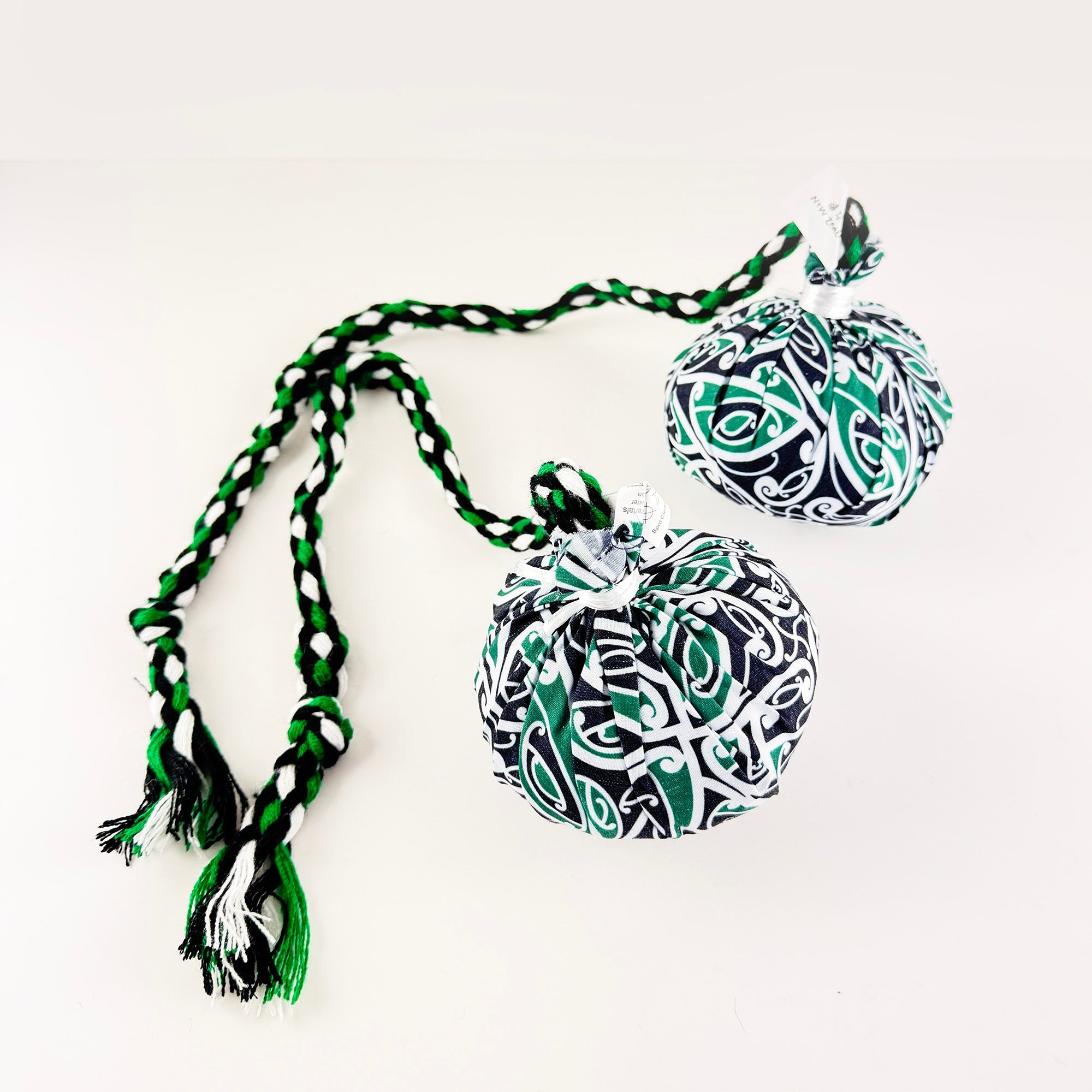 Set of Māori Poi with Green White and Black Patterned Cover - ShopNZ