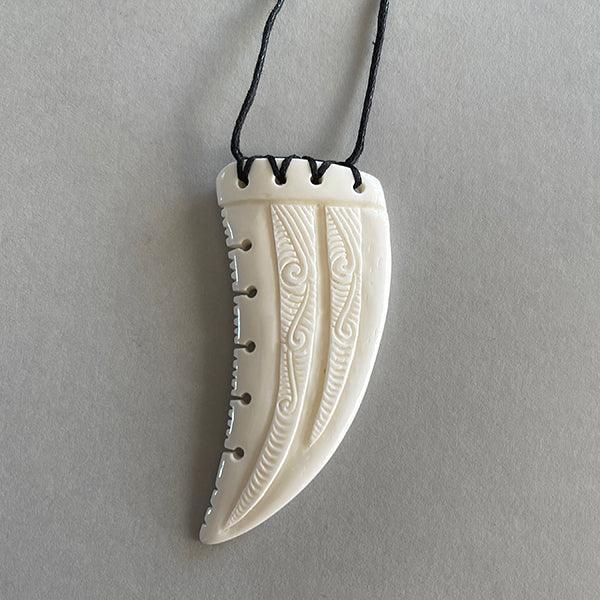 Intricately Carved Maori Bone Necklace In The Shape Of A Shark's Tooth - ShopNZ
