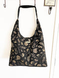 Black Slouch Shoulder Bag with Shiny Gold NZ Birds and Flora - ShopNZ