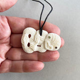 Intricately Carved Cow Bone Maori Tiki Necklace - ShopNZ